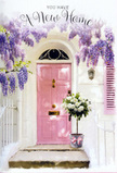 The scene shows a sun-washed Balham entrance that seems to breathe out a soft, welcoming sigh, ideal for marking the start of life in a new home. A pale pink door, newly painted and gently luminous, stands at the centre, surrounded by bright whitewashed walls that reflect the daylight in a calm, even glow. To one side, a coordinating shutter adds to the pastel charm, as if echoing the gentle character of the surrounding Balham streets and small front gardens. Overhead, generous strands of wisteria arch and fall across the doorway, their blossoms made up of tiny lavender and lilac flowers that hang like delicate tassels, hinting at a sweet, floral perfume. At the base of the doorway, a metal bucket in a muted grey tone holds a lush arrangement of white and cream roses, each bloom plump and velvety, arranged with the practiced eye of a local florist so that the bouquet feels both full and airy. Between the roses, soft green leaves and sprigs of foliage introduce a natural rhythm and depth, making the flowers look freshly gathered that morning from a nearby market. Around the bucket's base is a pink ribbon tied in a simple bow, its colour perfectly in tune with the front door and the wisteria above. The light creates soft shadows along the doorstep, suggesting a gentle afternoon, perhaps just after the movers have left. Everything about the image speaks of optimism, kindness, and the comforting ritual of bringing flowers into a new space, ideal for a housewarming gesture anywhere across Balham and the surrounding SW12 neighbourhoods.